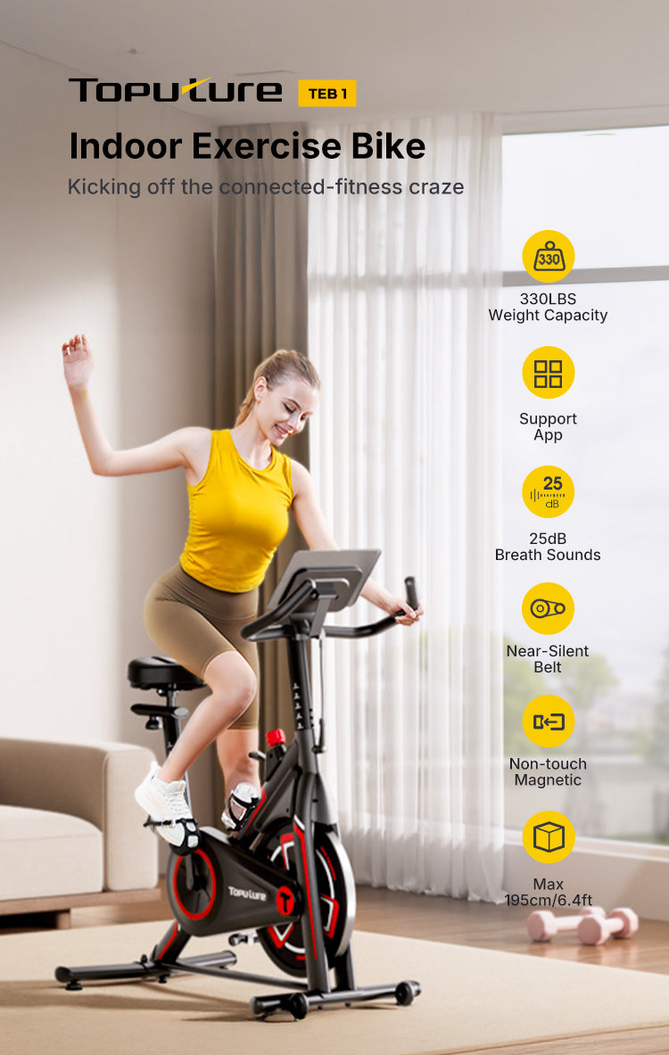 A woman enjoying an energetic indoor cycling workout on an exercise bike in her home living space.
