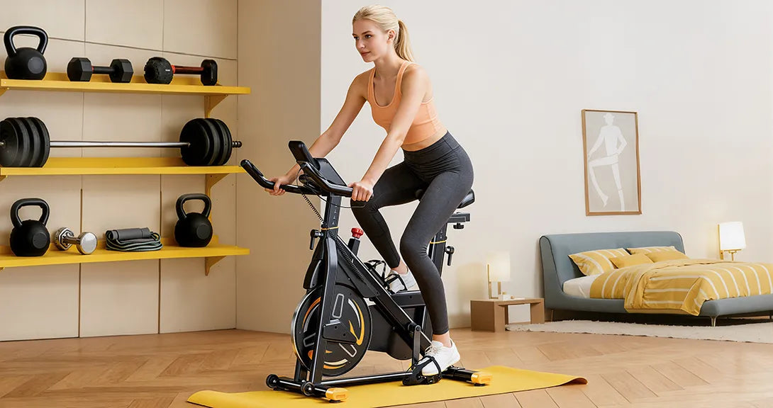 A woman cycling on an exercise bike in her dedicated home fitness corner, creating a personal workout space.