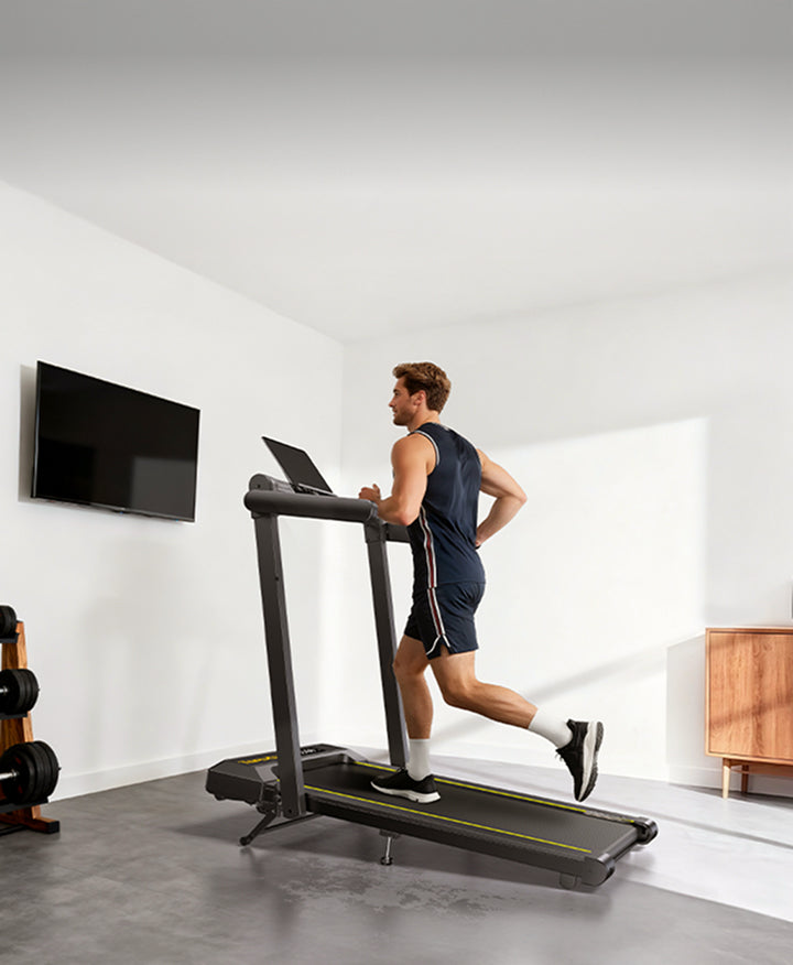 A man running on a Toputure TP5 treadmill in his modern home.