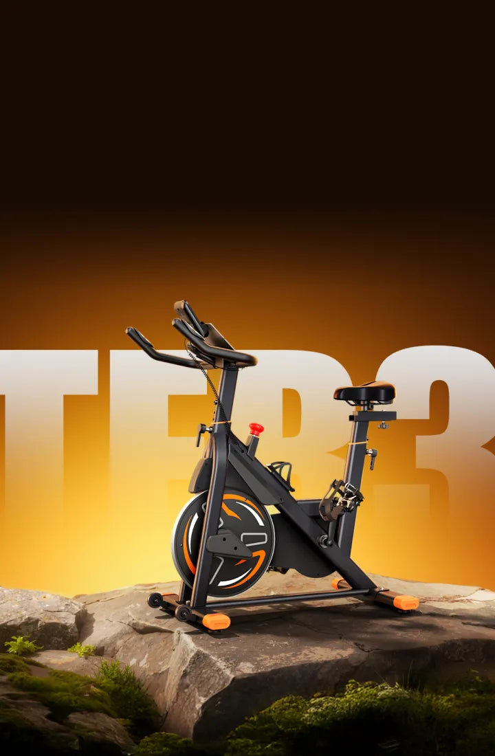 Exercise bike on a rocky surface with a blurred background.