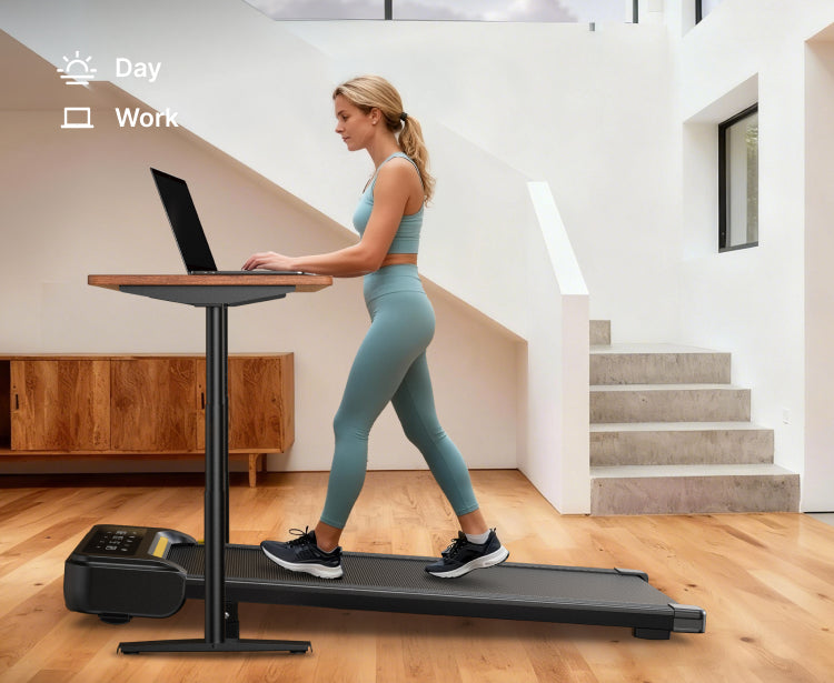 A woman walking on a treadmill at home during the daytime while using her laptop, illustrating a productive under-desk walking setup.

