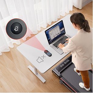 A woman walks under her desk on TP4, using the remote's mute button to ensure her workout doesn't disrupt phone calls or focus.
