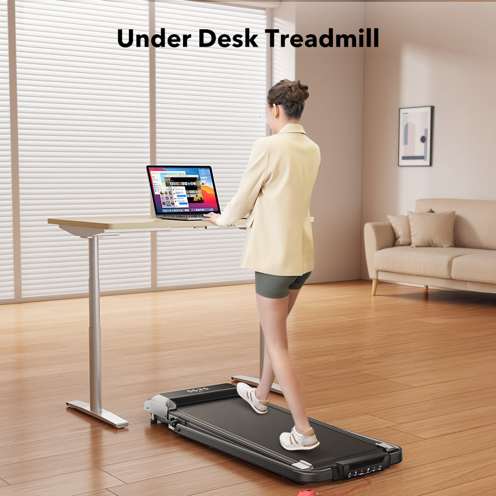 Person using A TP2 treadmill under a desk in a home office setting