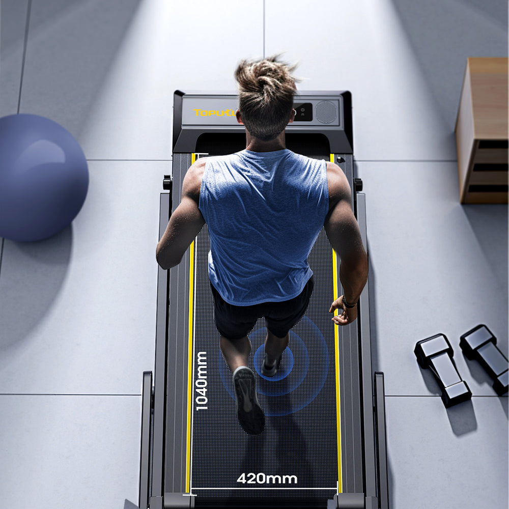 A man running on a treadmill with a spacious 16.5