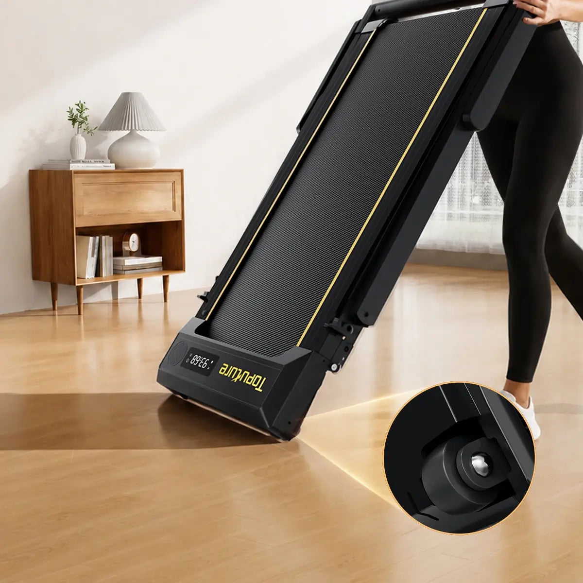 Toputure TP5 foldable treadmill with built-in transport wheels for easy movement and convenient home storage.