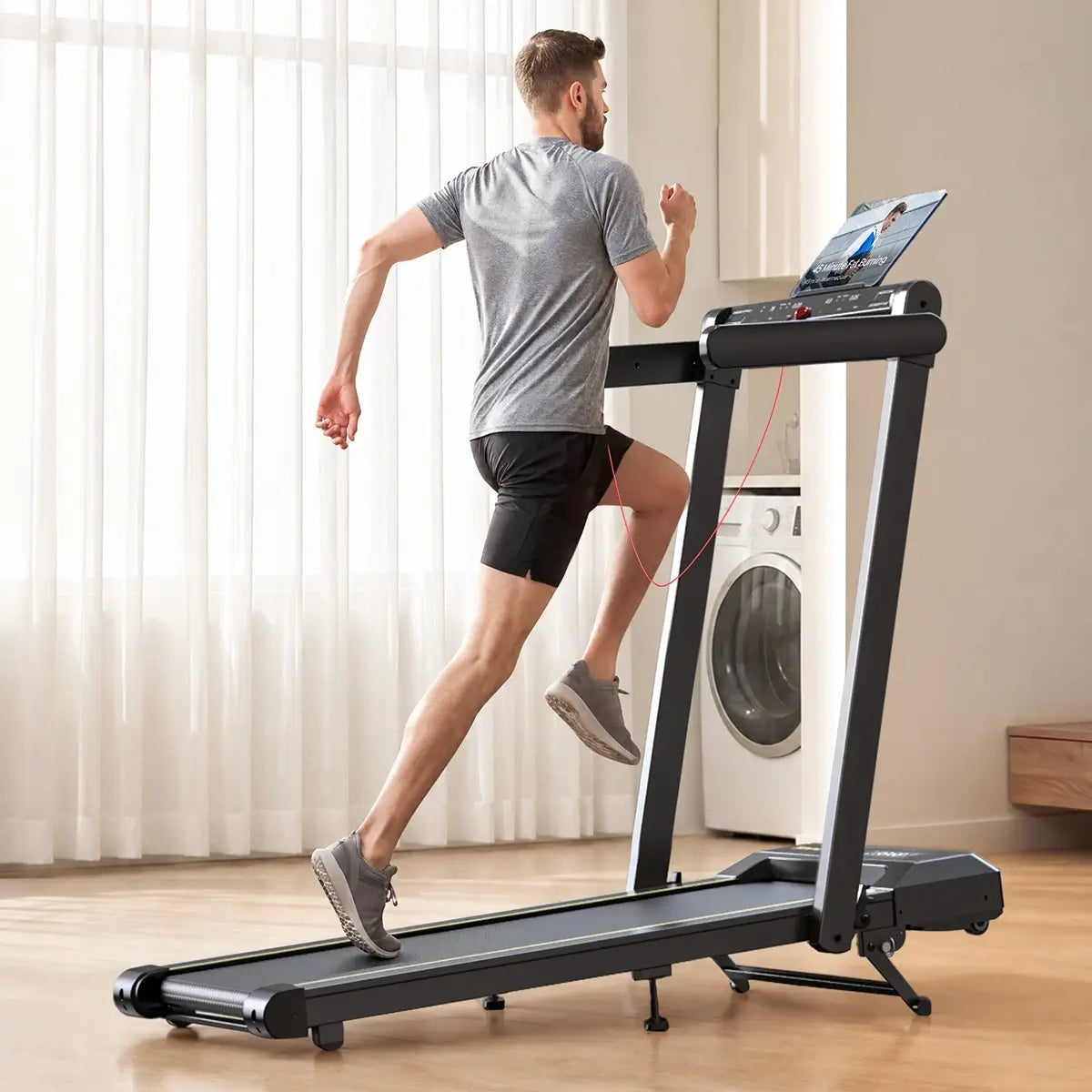 Toputure TP5 foldable treadmill for home running with a tablet holder for an immersive indoor workout experience.