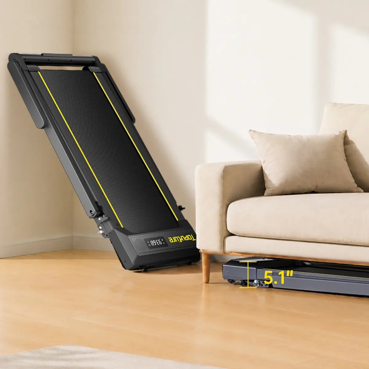 Toputure TP5 foldable treadmill standing upright for space-saving storage in a home living room.